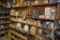 Contents in open wooden cabinet including: fittings, valves, fire extinguishers, etc., mainly