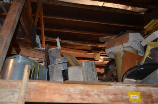 Contents in balcony area at south end of building including used diamond tread truck toolboxes, down