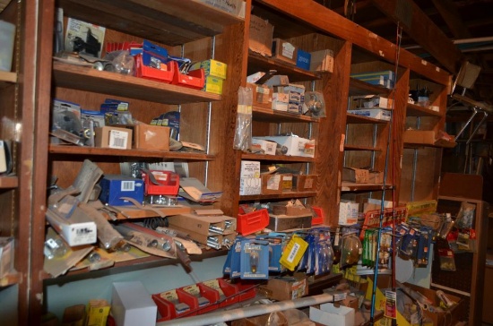Contents in open front store cabinet, east, to include: light bulbs, nylon twine, kids fishing