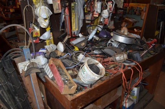 Contents of cabinet on east end: tools, drywall tools, ext. cords, motors, & more