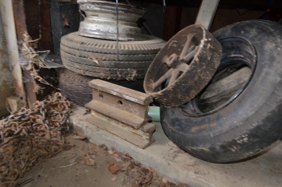 Misc. tires and rims at south end of building