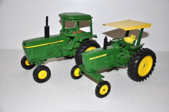 (2) John Deere 1/16 scale toy tractors - one w/cab; one w/canopy