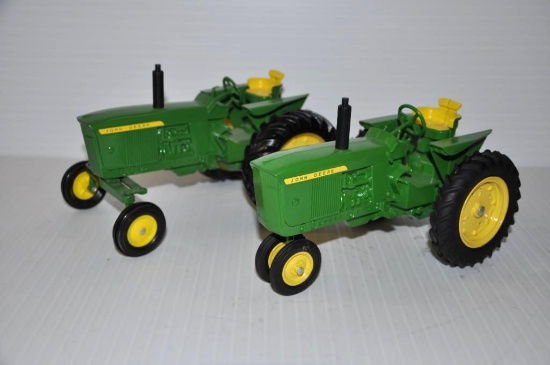 (2) John Deere 1/16 scale toy tractors - one narrow front; one wide front