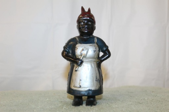 Cast Iron Lady With Spoon Bank