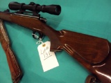 REMINGTON MODEL 700 BDL 30.06 WITH LEUPOLD 3X9X40 SCOPE, MONTE CARLO HIGH GLOSS WOOD WITH CHECKING,