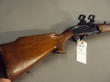 REMINGTON MODEL 742, WOODMASTER, 30/06 AUTOMATIC RIFLE WITH HIGH RISE SCOPE RING, SOME PITTING, NEED