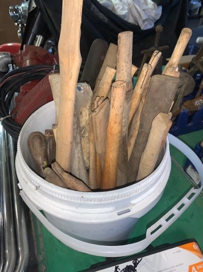 Bucket full of hammer handles