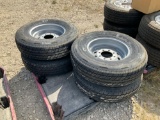 Four Unused ST235/80R16 Tires and Wheels