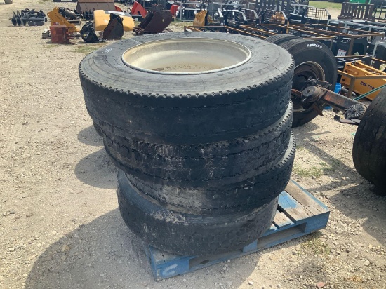 Four used 11R22.5 tires w/ wheels