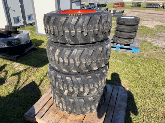 4 Unused Skid Steer Tires With Wheels