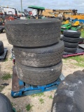 3 used commercial tires, two with wheels