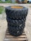 Four Camso 12-16.5 Skid Steer Tires and Wheels
