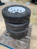 Four ST225/75R15 Unused Trailer Tires and Wheels