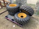 Four Unused 12-16.5 Skidsteer Tires with Rims