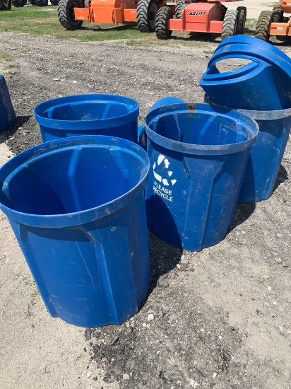 4 blue circular garbage cans and 6 lids
