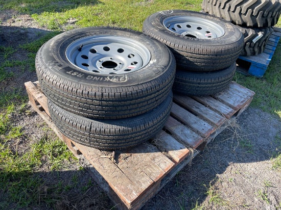 Four Unused 205/75R15 Trailer Tires and Wheels