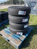 Four Unused ST235/80R16 Trailer Tires and Wheels