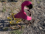 Flamingo on a bike flower pot holder
