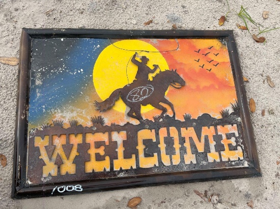 Welcome sign with cowboy