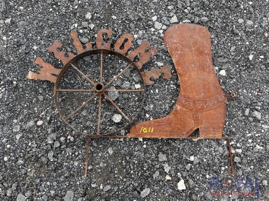 Welcome sign with wagon wheel and cowboy boot