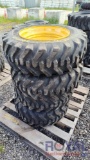 (4) Unused Skid Steer Tires with Wheels