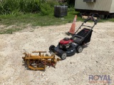 1 Trimer Rack and 1 Troy Bilt Lawn Mower