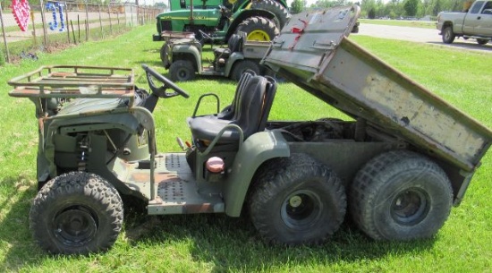 John Deere 6X4 diesel military Gator with 975 hours and electric dump box.