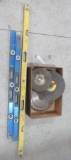 Various saw blades and (3) levels. Largest level measures 6'.