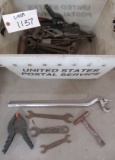 Various antique tools including wrenches, clamps, etc.