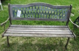 Outdoor bench with cast iron legs.