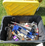Plastic tote and lid with assortment of painting supplies.