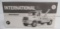 1st Gear 1/34 scale international 4400 series tow truck in box.