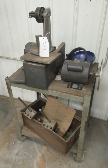 Delta Sander/grinder On Rolling Stand. Measures 32" H X 25" W X 18 3/4" D.