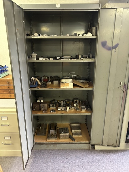 Metal Cabinet With A Large Assortment Of Setups And Tooling.