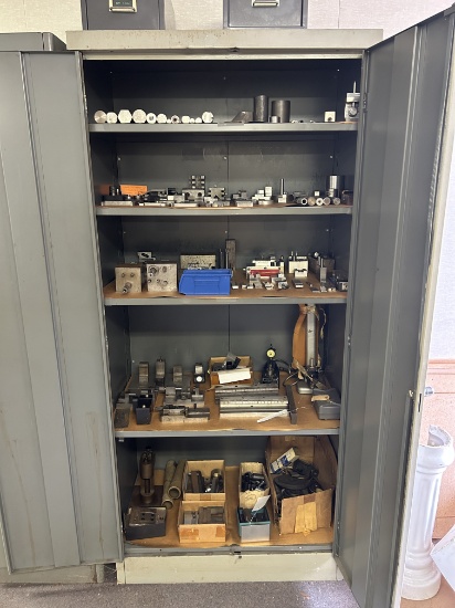 Metal Cabinet With A Large Assortment Of Setups And Tooling.
