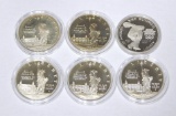 SIX (6) PROOF COMMEMORATIVE SILVER DOLLARS - (5) 1986 ELLIS ISLAND + (1) 1983 OLYMPICS