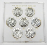 7 UNCIRCULATED SILVER EAGLES IN HOLDER - 1986 to 1992
