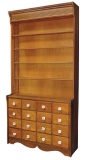 Apothecary Cabinet, 19th C., one-piece oak w/16 drawer base below 4 setback
