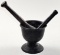 A Cast Iron Mortar & 2 Pestles