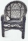 A Child's Woven Wicker Armchair