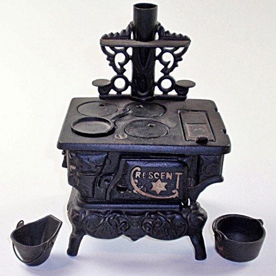 A Vintage Crescent Toy Cast Iron Stove in near mint cond, 6"W.