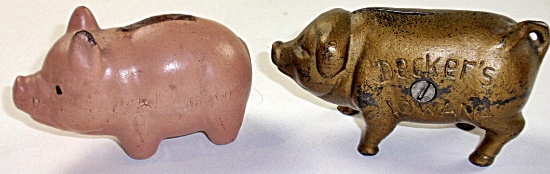 2 Pig Banks: cast iron "Decker's Iowana, and a painted composition VG+ cond