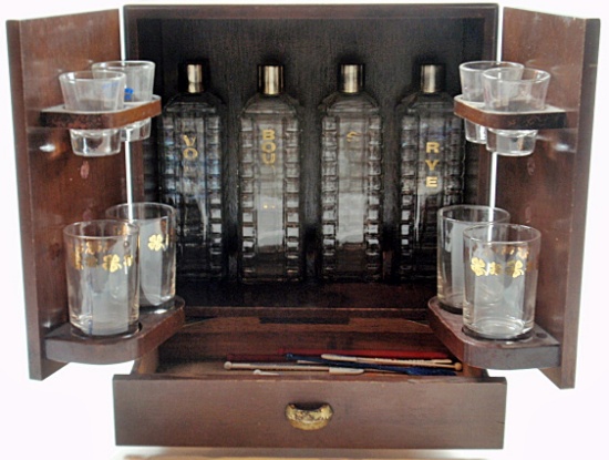An MCM Wood Cased Bar Set