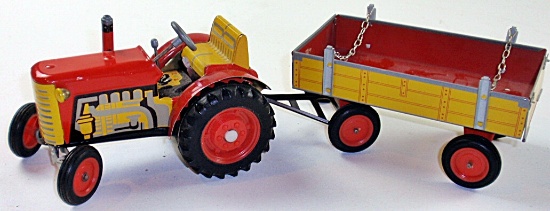 A Zetor Toy Wind-Up Tractor & Wagon