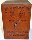 A Laurel & Hardy Pyrography wood music box/bank, Exc working cond 1978 by T