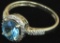 Ring tests 14K with blue & clear stones. Approx 2.6 grams.