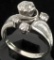Ring marked 14K with (4) diamonds. Approx 4.1 grams.
