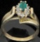Ring marked 10K with green & clear stones. Approx 3.0 grams.