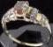 Ring marked 14K with orange & clear stones. Approx 2.3 grams.