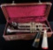 Vintage Trumpet made by C.G. Conn Ltd. in case. With (2) vintage Trumpet Mutes.